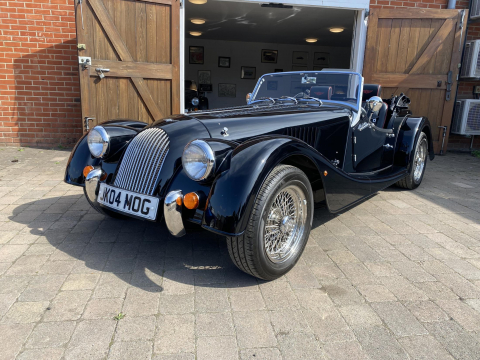 2016 Morgan plus 4 GDI in black.